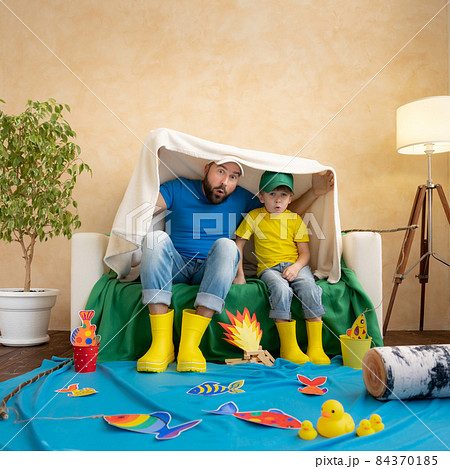 Dad and son enjoy a fishing trip Dad and son enjoy a fishing trip 84370185