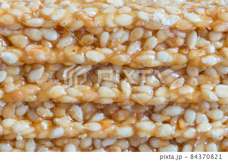 Close-up for sesame seed of bars of sesame seed candy. Close-up for sesame seed of bars of sesame seed candy. 84370821