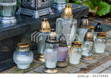 Burnt out grave candles after All Saints' Day. Burnt out grave candles after All Saints' Day. 84370948