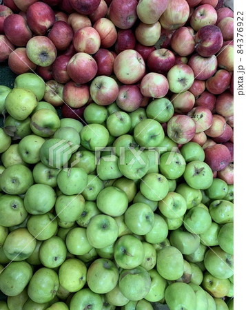 lots of ripe sweet apples for food as a background lots of ripe sweet apples for food as a background 84376922