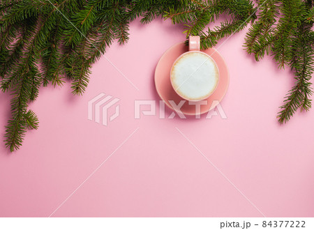 Top view of cup of cappuccino on pink background 84377222