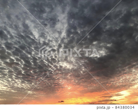 Sunset with blue sky and grey-pearl clouds, background Sunset with blue sky and grey-pearl clouds, background 84380034