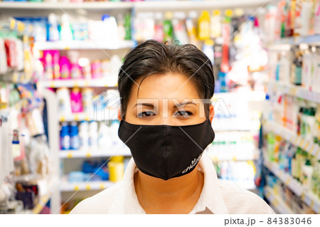Happy natural asian woman in supermarket. Looking camera 84383046