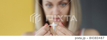 Woman holds open medical medicinal candle in hands 84383487