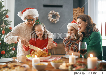 family celebrating Christmas family celebrating Christmas 84384381