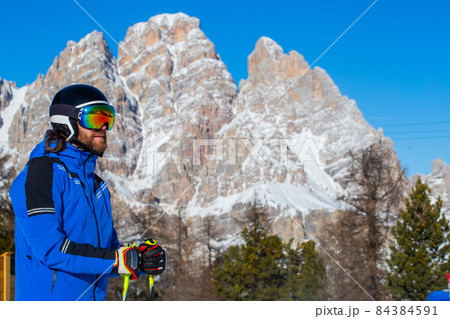 Happy skier on slope at Cortina 84384591