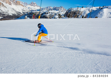 Alpine skier on slope at Cortina 84384694