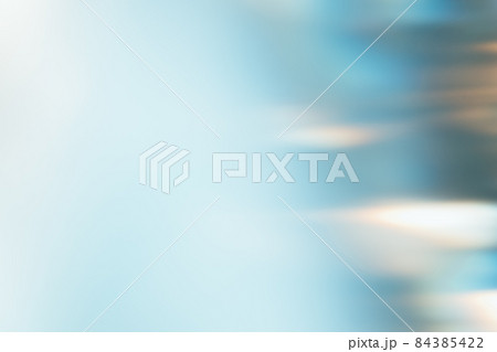 Light flare filter. Blur glow overlay. Sunlight reflection. Bokeh radiance. Defocused blue white orange color gradient texture abstract background. 84385422