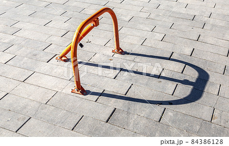 Equipment on street pavement to prevent car parking. Mechanical folding barrier 84386128