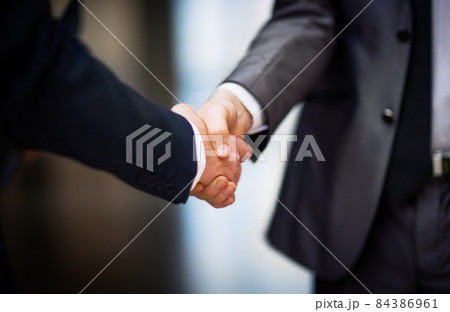 Business people shaking hands Business people shaking hands 84386961