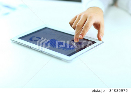 Businessman with finger touching screen of a digital tablet 84386976