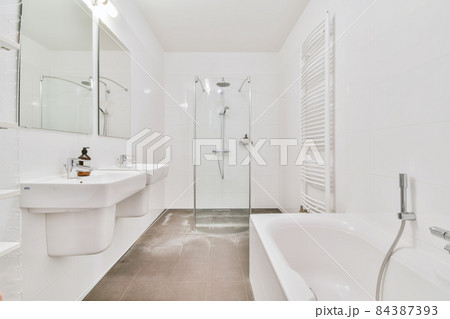 Interior design of an illuminated simple bathroom 84387393