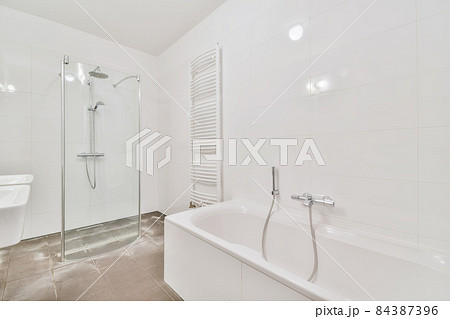 Interior design of an illuminated simple bathroom 84387396