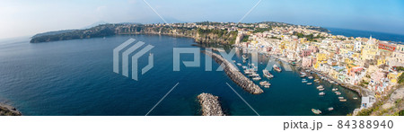 Aerial drone view of Italian island Procida. Marina Corricella and fort 84388940