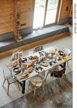 Served festive table with kitchenware, homemade food and decorations 84389700