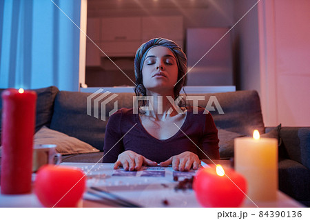 Calm fortune-teller getting ready for card reading 84390136
