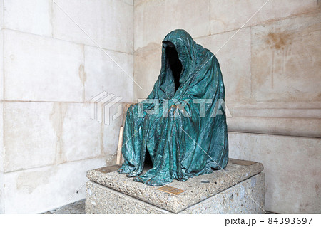 Die Pieta, the sculpture at the southern archway of Salzburg Cathedral in Austria. 84393697
