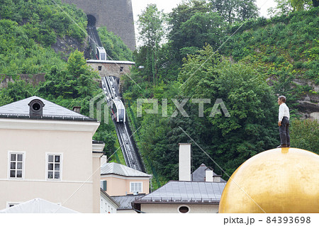 View of funicular railway tram to Hohensalzburg Fortress on the mountain. View of funicular railway tram to Hohensalzburg Fortress on the mountain. 84393698