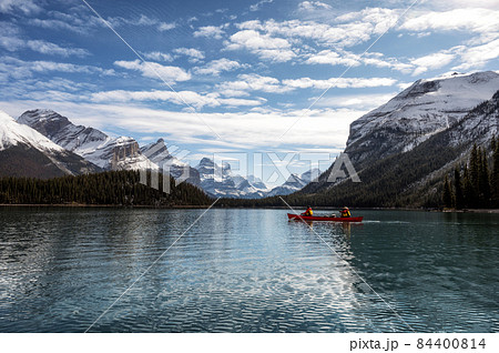 Tourists canoeing into the Spirit Island on Maligne lake at Jasper national park, Canada Tourists canoeing into the Spirit Island on Maligne lake at Jasper national park, Canada 84400814