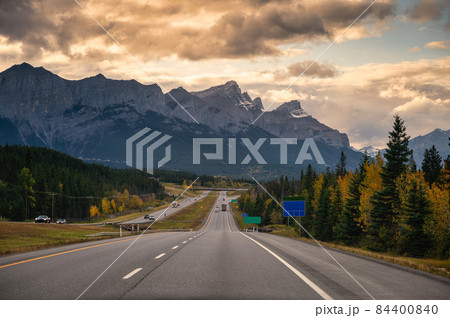 Road trip of car driving on highway with rocky mountains in the evening at Banff national park 84400840