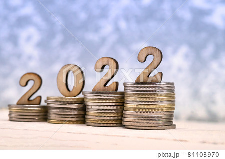 Banner 2022. Coins and Figures 2022. Money stacked in columns. Banner 2022. Coins and Figures 2022. Money stacked in columns. 84403970