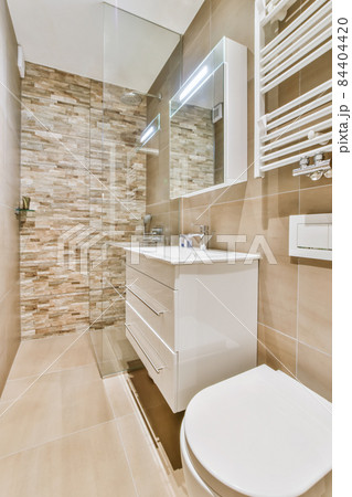 Interior of small clean restroom in miniature style Interior of small clean restroom in miniature style 84404420
