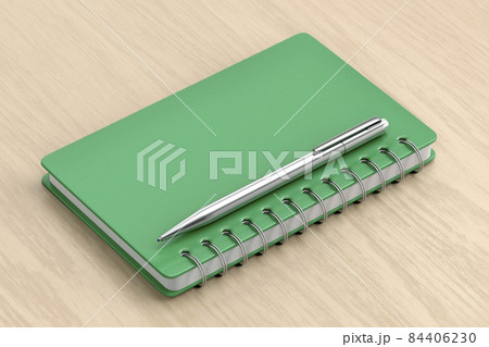 Green notebook and silver pen 84406230