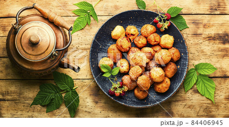 Curd donuts with raspberries for tea Curd donuts with raspberries for tea 84406945
