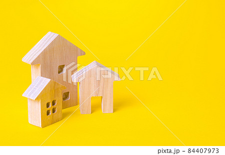 Residential buildings on a yellow background. Buying and selling real estate. Renting housing, realtor services. Renovation and home improvement. Mortgage loan. Building maintenance. 84407973