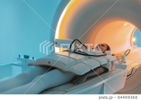 Medical CT or MRI Scan with a patient in the modern hospital laboratory. Interior of radiography department. Technologically advanced equipment in white room. Magnetic resonance diagnostics machine. Medical CT or MRI Scan with a patient in the modern hospital laboratory. Interior of radiography department. Technologically advanced equipment in white room. Magnetic resonance diagnostics machine. 84409368