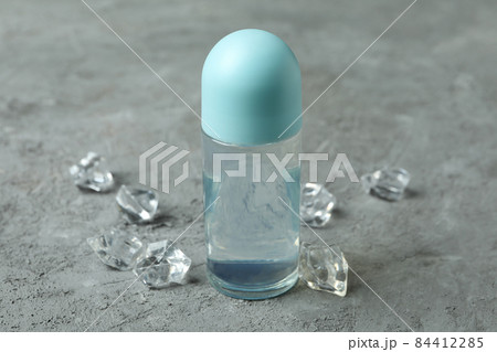 Blank deodorant and ice cubes on gray textured background Blank deodorant and ice cubes on gray textured background 84412285