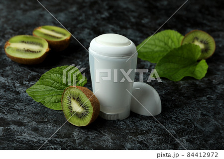 Blank kiwi deodorant on black smokey background 84412972