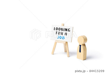 Unemployed employee figurine looking for a job. Finding a better job. Change of workplace. Search and recruitment of new employees for work. Hire staff. Employment Agency. Recruiting, staffing. Unemployed employee figurine looking for a job. Finding a better job. Change of workplace. Search and recruitment of new employees for work. Hire staff. Employment Agency. Recruiting, staffing. 84413209