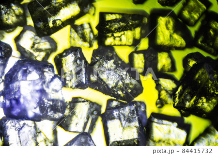 Crystal sugar close up on black background under the light microscope with a magnification of 40 times Crystal sugar close up on black background under the light microscope with a magnification of 40 times 84415732