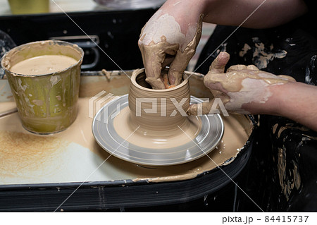 Clay modeling training on a potters wheel, clay master class. Art, creativity. Modeling clay, cultural traditions, hobby 84415737