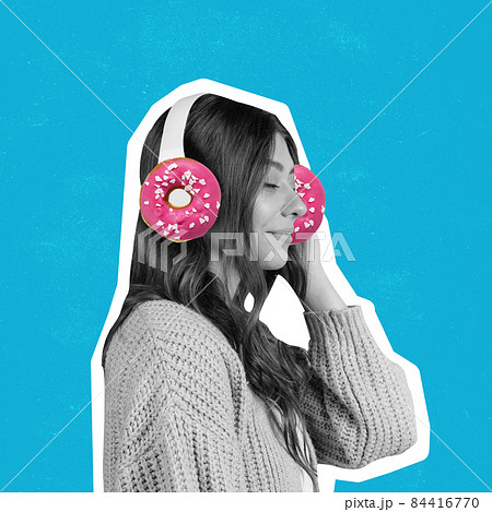 Contemporary art collage of young cal woman listening to music in headphones with pink donuts isolated over blue background 84416770