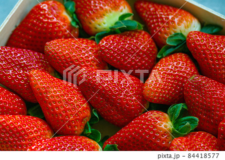 Fresh harvested strawberries background, concept of healthy eating vegan food. Close up, selective focus 84418577