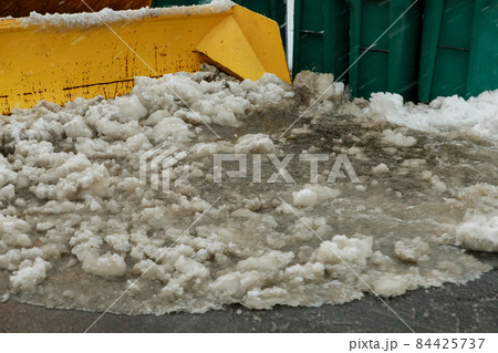 Tractor clears the snow removal vehicle removing snow way after heavy snowfall 84425737