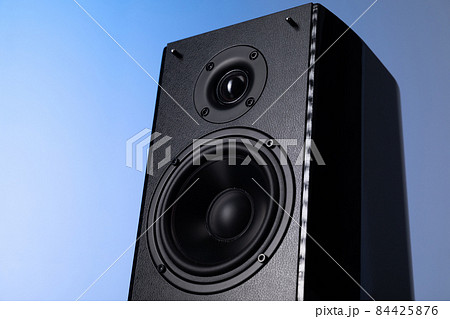 huge speaker for listening to music on a blue background, bottom view huge speaker for listening to music on a blue background, bottom view 84425876