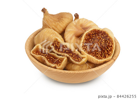 dried fig in wooden bowl isolated on white background with clipping path and full depth of field 84426255