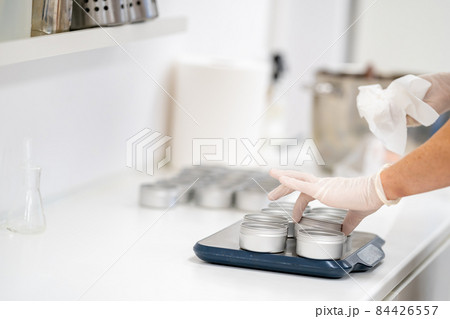 filling molds with hand-made natural organic cosmetics 84426557