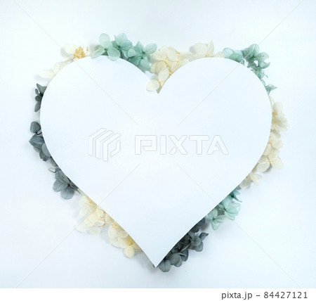 Flowers composition from blue and yellow flowers in the form of a heart on white background. Spring, summer template for your projects Flowers composition from blue and yellow flowers in the form of a heart on white background. Spring, summer template for your projects 84427121
