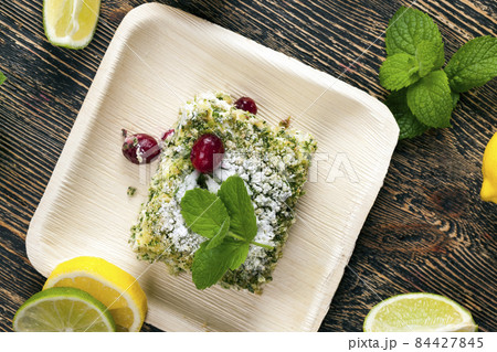 green cake with cream and lime 84427845