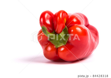 Ugly shaped organic vegetables. Deformed homegrown bell pepper isolated. white background Ugly shaped organic vegetables. Deformed homegrown bell pepper isolated. white background 84428318