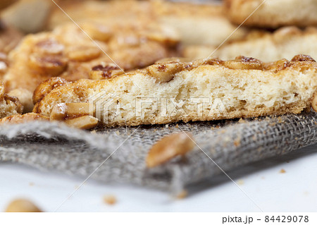 on the surface of a round cookie caramel with peanuts on the surface of a round cookie caramel with peanuts 84429078