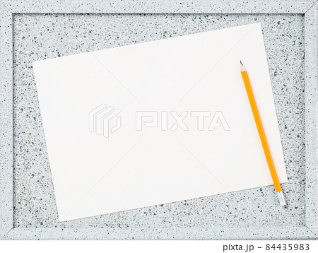 Blank paper leaf on notice board. grey 84435983