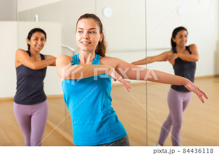 Group of smiling women training sport dance Group of smiling women training sport dance 84436118