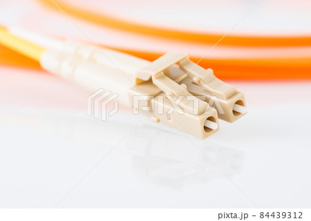 Fiber optical patch cord with LC plug connector close-up 84439312