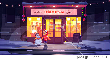 Little girl and snowman at winter bar, Christmas 84440761