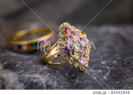 Gemstone jewelry golden ring. 84442648